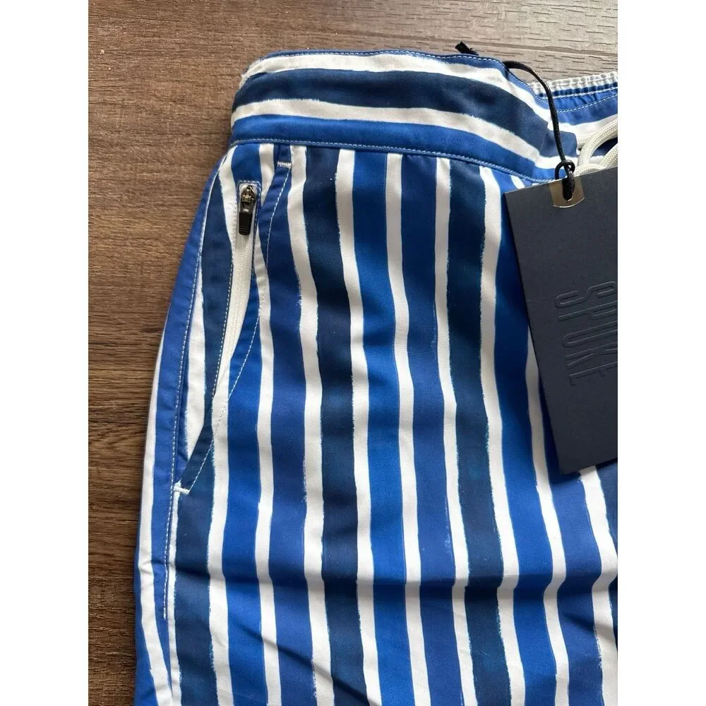 Spoke swim trunks